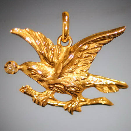 Victorian gold bird holding diamond in beak