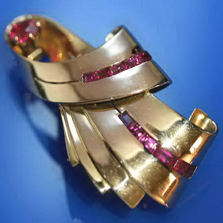Bow shaped golden retro brooch with rubies