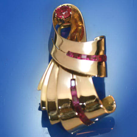Bow shaped golden retro brooch with rubies