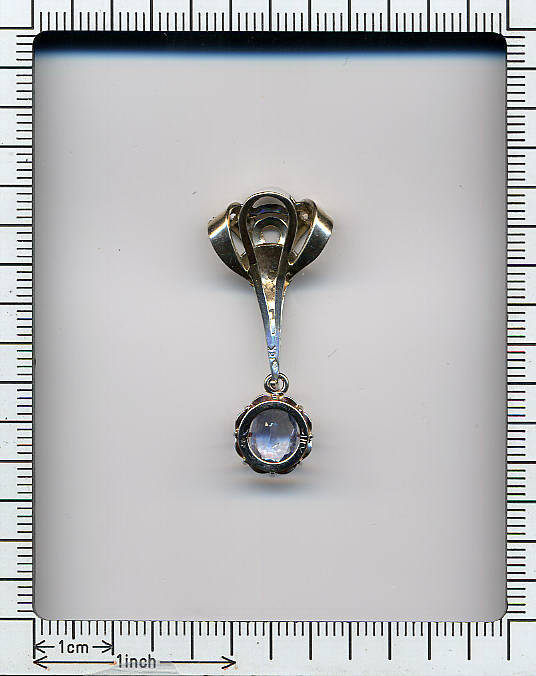 Expressive sapphire and diamond pendant
