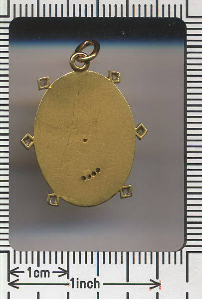 Art Nouveau woman's head golden pendant