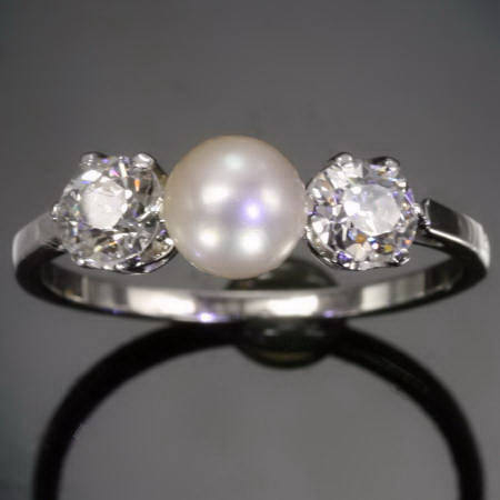 Platinum brilliants and pearl engagement ring