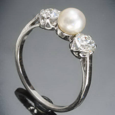 Platinum brilliants and pearl engagement ring