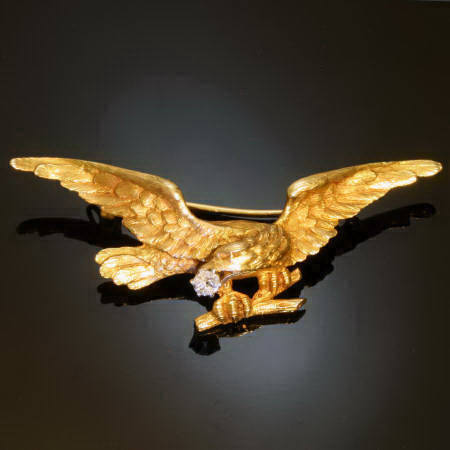 Victorian golden flying eagle with brilliant in beak
