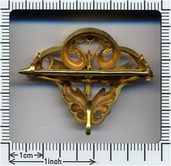 Golden Art Nouveau brooch and pendant with thistle motive