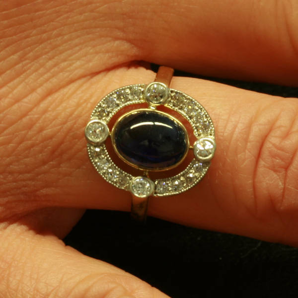 Estate diamond and emerald engagement ring