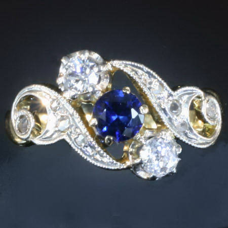 Curly late Victorian early Art Nouveau diamonds and sapphire engagement ring