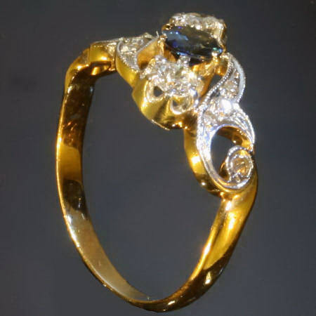 Curly late Victorian early Art Nouveau diamonds and sapphire engagement ring