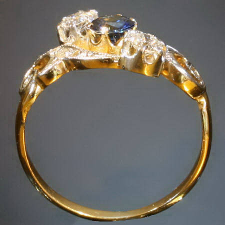 Curly late Victorian early Art Nouveau diamonds and sapphire engagement ring