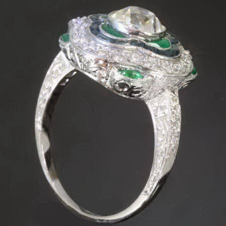 Platinum diamond sapphires and emeralds Art Deco inspired engagement ring