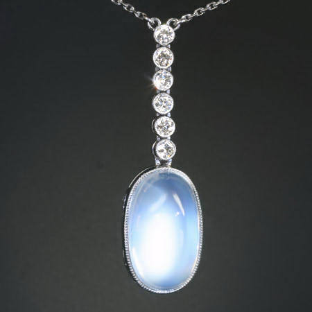Platinum Art Deco diamond pendant with huge magnificent moonstone