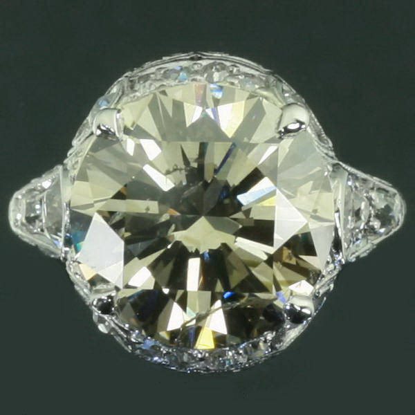 Extravagant estate engagement ring with one 6 crt bulky stone