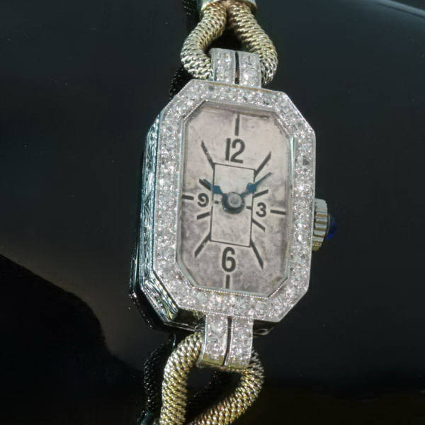 Art deco ladies watch in platinum and yellow gold set with diamonds