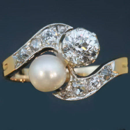 Victorian two stone crossover engagement ring diamond pearl