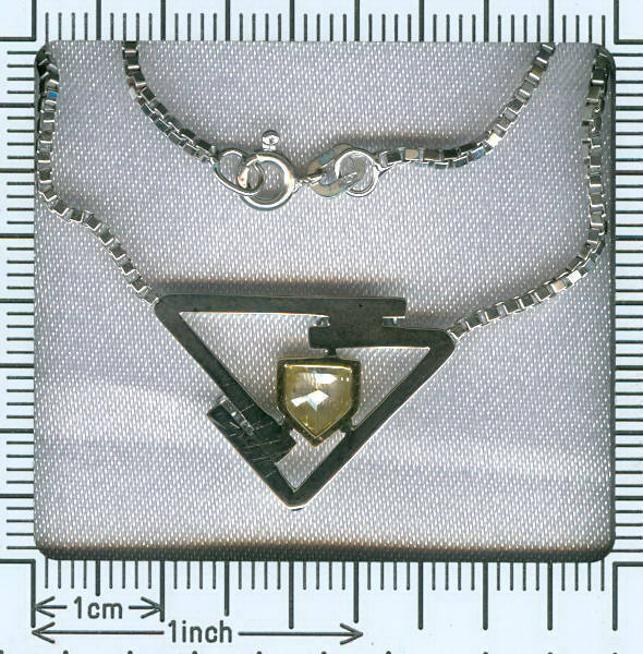 Gold pendant, typically modern Seventies design with fancy cut and color diamond