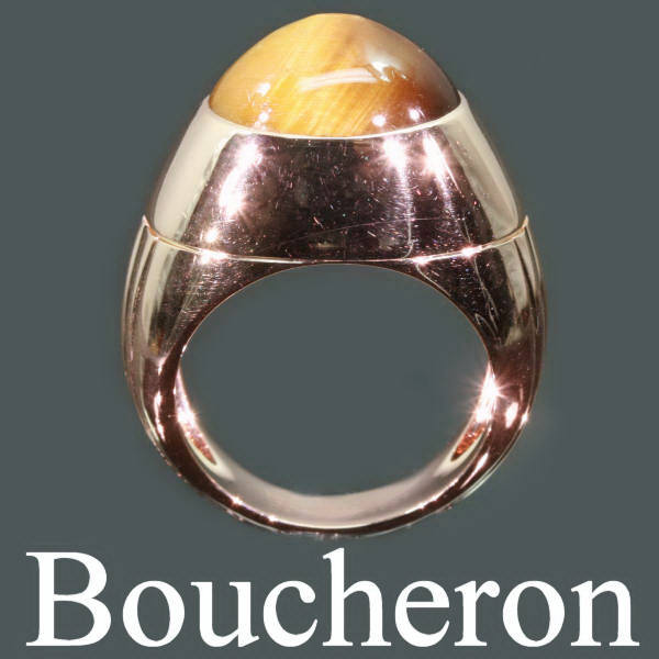Signed classical Boucheron ring with high domed tigereye cabochon