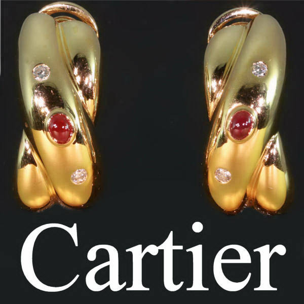 Gold estate earrings by Cartier with brilliants and rubies (image 1 of 4)