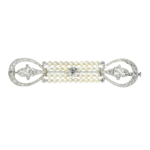 Era's Elegance: Exquisite Diamond and Pearl Brooch from the Dawn of Art Deco